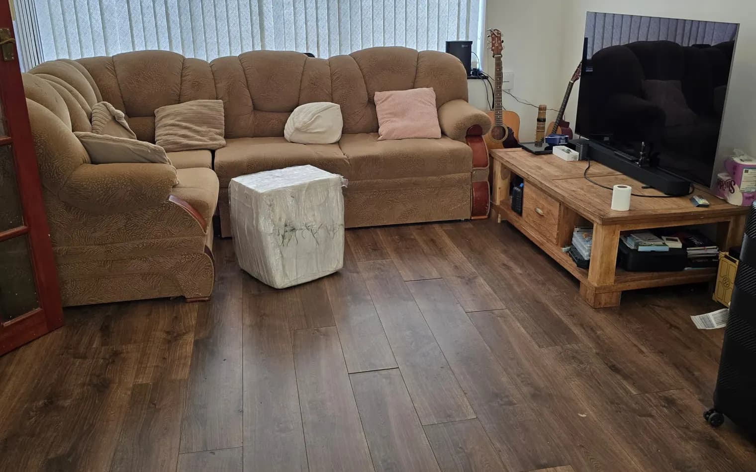 The same living room after the deep clean, tidy and with the floor clear